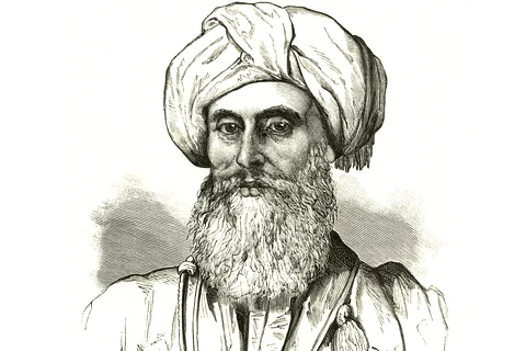Czarno biały szkic przedstawia portret mężczyzny w sile wieku z siwym wąsem i gęstą siwą brodą. Na głowie ma turban. okrycie też wygląda na arabskie.