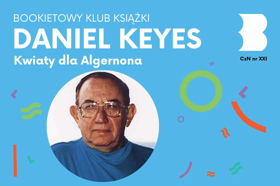 Łysiejący mężczyzna w dużych okularach w niebieskiej bluzie.