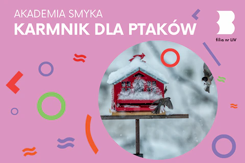 Zdjęcie zaśnieżonego, czerwonego karmnika dla ptaków, przy którym fruwają dwa małe ptaszki.