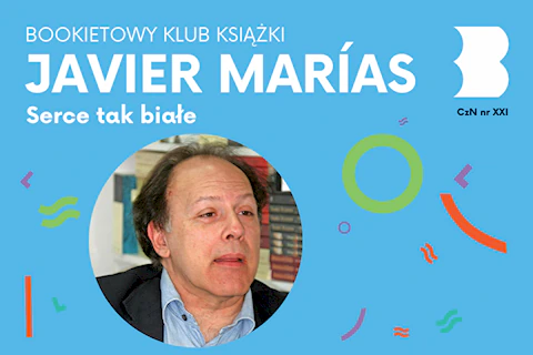 Dojrzały mężczyzna, nieco łysiejący, na tle półek z książkami, patrzy gdzieś na prawo.