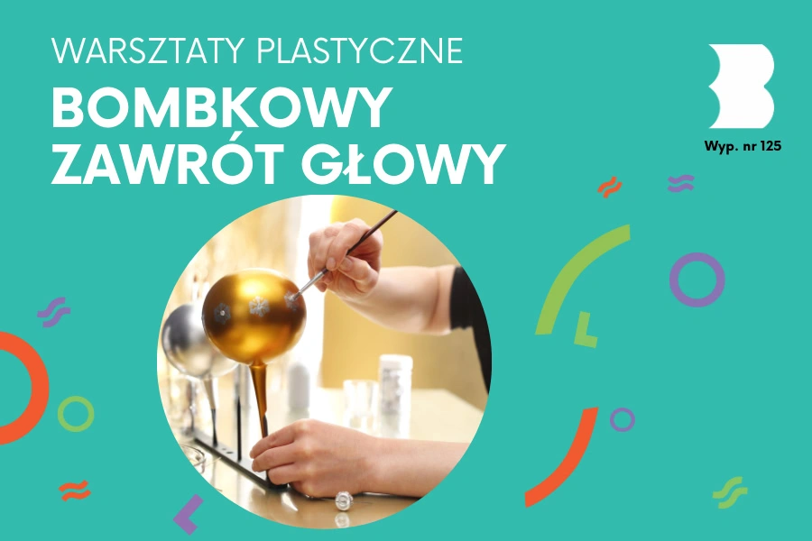 Ręce malują cienkim pędzelkiem gwiazdki na złotej bombce.
