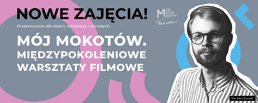 Młody brodaty mężczyzna w okularach patrzy w obiektyw.