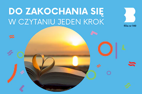 Otwarta książka widziana od spodu. Dwie środkowe kartki zostały ukształtowane w wizerunek serca. A to wszystko na brzegu jeziora na tle zachodzącego Słońca.