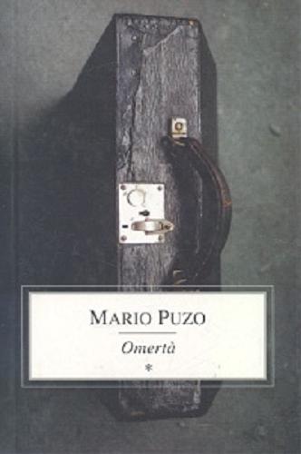 Okładka książki Omerta / Mario Puzo ; przełożył Marek Fedyszak.