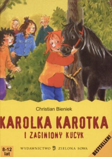 Okładka książki Karolka Karotka i zaginiony kucyk / Christian Bieniek ; il. Irmgard Paule ; tł. Anna Pawlik.
