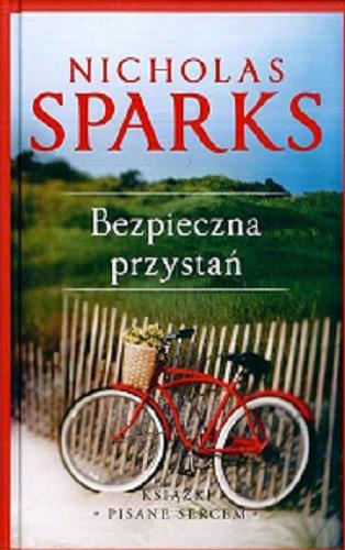 Okładka książki Bezpieczna przystań / Nicholas Sparks ; z angielskiego przełożyła Ewa Wojtczak.